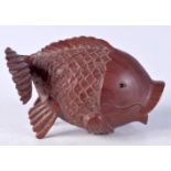 A JAPANESE CARVED BOXWOOD FISH. 7.75 cm x 3.5 cm.
