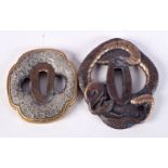 TWO JAPANESE TSUBA ONE DECORATED WITH A SNAKE AND THE OTHER WITH FLOWERS. Largest 8.8cm x 7.4cm, to