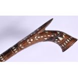 A VINTAGE TURKISH MIDDLE EASTERN MOTHER OF PEARL INLAID GUN FORM WALKING CANE. 93 cm long.