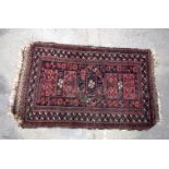 A small Persian rug 90m x 54 cm