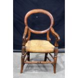 A Victorian Balloon back Childs chair with reed seat. 61 x 33 x 32 cm.