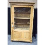 A large pine glazed, shelved cupboard 171x102x49cm