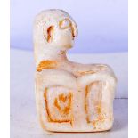 A small Egyptian marble carving of a seated male 6 x 4 cm.