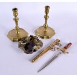 A PAIR OF GEORGE III BRASS CANDLESTICKS together with a knife and brush washer. Largest 17 cm high.