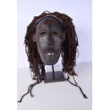 An African Tribal mask on a stand