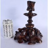 A LARGE 19TH CENTURY BAVARIAN BLACK FOREST CARVED WOOD CANDLESTICKS overlaid with leaves. 26 cm x 12