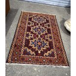 An Oriental rug. 180 x 113cm.