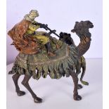 A COLD PAINTED BRONZE IN THE BERGMAN STYLE OF A LION ATTACKING AN ARAB MOUNTED ON A CAMEL. 17cm x 1