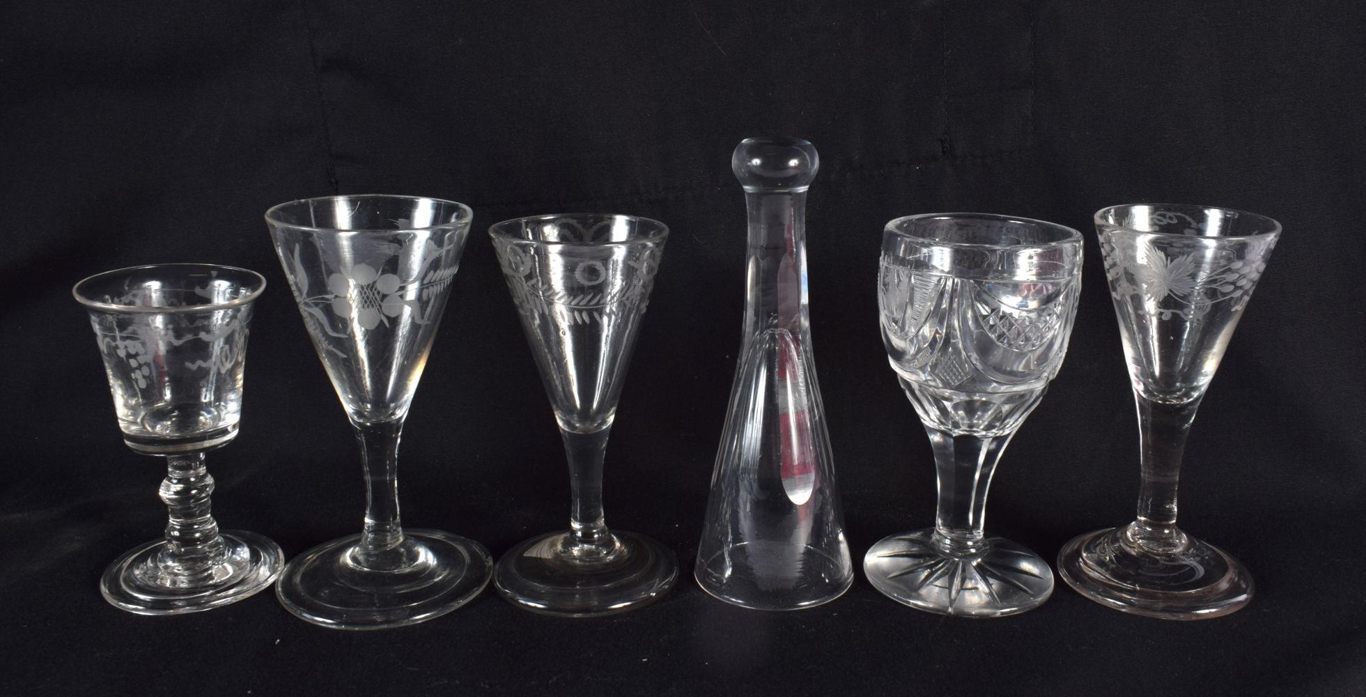 FIVE ANTIQUE WINE GLASSES and another. Largest 12 cm high. (6)