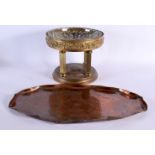 A LARGE ART NOUVEAU COPPER TRAY together with an Arts and Crafts brass pedestal fruit bowl. Largest