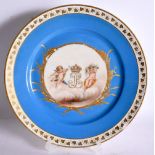 AN EARLY 20TH CENTURY FRENCH PARIS PORCELAIN SEVRES STYLE PLATE painted with putti and a monogram. 2