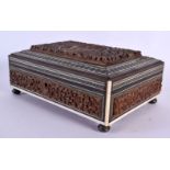A 19TH CENTURY ANGLO INDIAN CARVED SANDALWOOD CASKET decorated with figures. 21 cm x 14 cm.