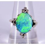 AN OPAL RING SET WITH DIAMONDS. Size N/O, weight 3.4g