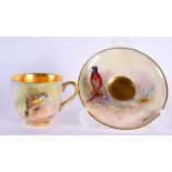 Royal Worcester demi tasse cup and saucer painted with a Mallard or a Pheasant by P. Lynes, signed,