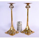 A LARGE PAIR OF ARTS AND CRAFTS BRASS CANDLESTICKS. 34 cm high.