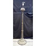 A large South East Asian embossed brass lamp stand 193 cm.
