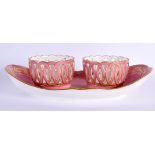 Sevres style boat shaped condiment holder with pink ground and gilded decoration, crossed Ls and C