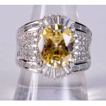 A SILVER CZ RING. 12 grams. R.