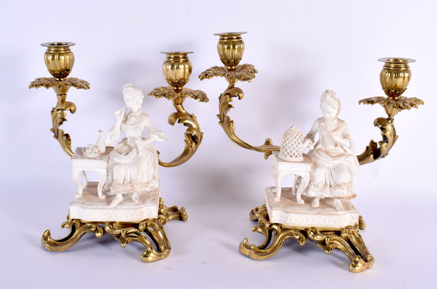 A LOVELY PAIR OF 19TH CENTURY MINTON BISCUIT PORCELAIN COUNTRY HOUSE CANDLESTICKS with gilt bronze m