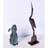 A bronze rabbit together with a horn figure of a bird largest 31 cm .