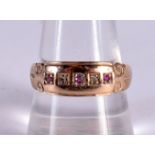 A 9CT GOLD RING SET WITH DIAMONDS AND RUBIES. Size T, weight 2g