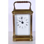 A LARGE ANTIQUE FRENCH BRASS CARRIAGE CLOCK. 18 cm high inc handle.