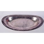 AN ART AND CRAFTS HAMMERED WHITE METAL DISH. 365 grams. 32 cm x 15 cm.
