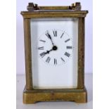 A FRENCH BRASS CARRIAGE CLOCK. 12 cm high inc handle.