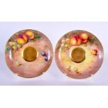 A PAIR OF ROYAL WORCESTER FRUIT PAINTED SAUCERS by Cook. 13 cm wide.