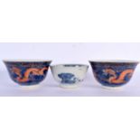 A PAIR OF 19TH CENTURY CHINESE CORAL DRAGON BLUE AND WHITE TEABOWLS bearing Kangxi marks to base, to