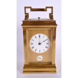 AN ANTIQUE FRENCH REPEATING BRASS CARRIAGE CLOCK with twin dials. 17 cm high inc handle.