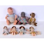 A collection of vintage dolls largest together with an early stuffed monkey 33 cm