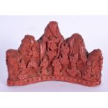 A RARE CHINESE QING DYNASTY CARVED CINNABAR LACQUER BRUSH REST Ming style, unusually decorated with