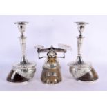 A LOVELY PAIR OF VICTORIAN SILVER PLATED HORSE HOOF CANDLESTICKS with matching weights, Largest 27 c