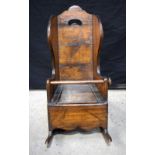 A late 18th Century wing backed rocking chair commode (Possibly Welsh)69cm high.