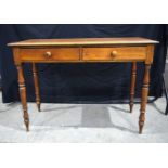 An antique two drawer Hall table with turned legs 76 x 107 x 45 cm.