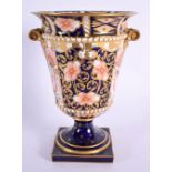 Royal Crown Derby imari pattern 6299 campana vase with two handles and two beaded borders on a squar