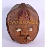 AN UNUSUAL INDIAN CARVED COCONUT FOLK ART SMOKING MAN. 19 cm x 14 cm.