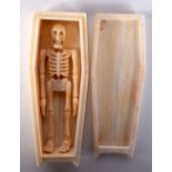 A NOVELTY BONE SKELETON COFFIN. 136 grams. 11.5 cm x 4.5 cm.