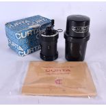 A BOXED CURTA CALCULATOR. 12 cm high.