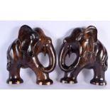 A PAIR OF ANTIQUE INDIAN CARVED HARDOWOD ELEPHANT WALL PLAQUES with bone feet. 21 cm x 18 cm.