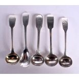 FIVE SILVER CONDIMENT SPOONS. Various hallmarks including Dublin 1927, London 1843 + 1844, Largest