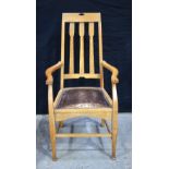 A Thompson Edwards and Sons Newcastle Arts & Crafts style Oak armchair with Label to underneath 110