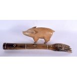 AN EARLY 20TH CENTURY INDIAN MOTHER OF PEARL INLAID WOODEN ARM together with a bone inset wood pig.