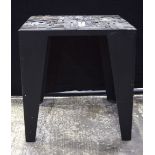 A contemporary metal table with a wooden design of print blocks 64 x 60 cm.