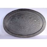 A VERY LARGE ANTIQUE PERSIAN TINNED COPPER OVAL TRAY decorated with repousse birds. 98 cm x 67 cm.