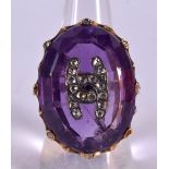 A LARGE YELLOW METAL DIAMOND AND AMETHYST RING. 17.1 grams. N.