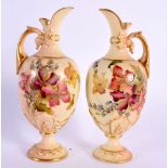 Royal Worcester rare pair of miniature ewers painted with flowers on a blush ivory ground date mark