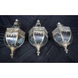 A set of three storm lanterns with hanging mounts 56 cm (3).