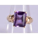 A 10CT GOLD AND AMETHYST RING. 2.8 grams. M.